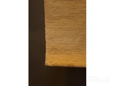 Handknuten matta i beige färg, ca 120x62 cm
