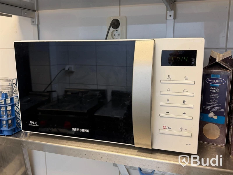 3 stainless steel shelves and a Samsung microwave oven