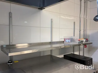 3 stainless steel shelves and a Samsung microwave oven