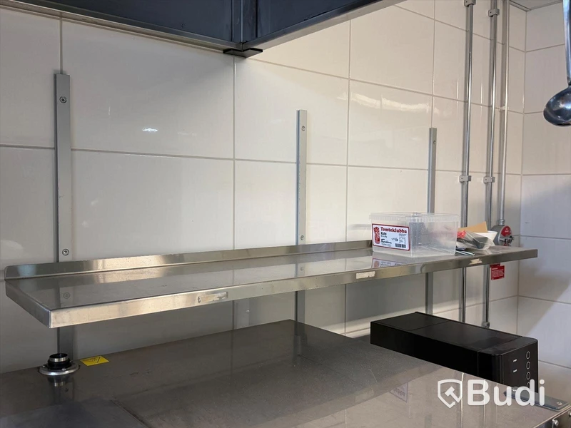 3 stainless steel shelves and a Samsung microwave oven