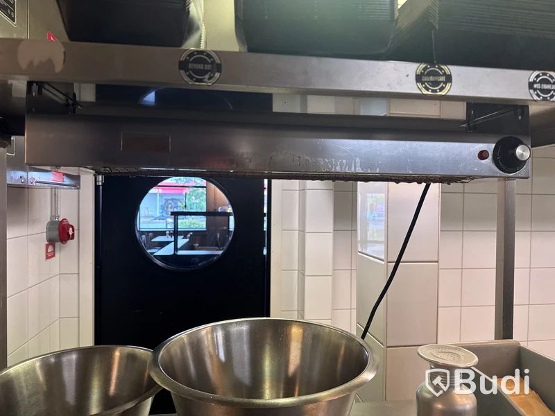 Rostfri hylla med värmelampa