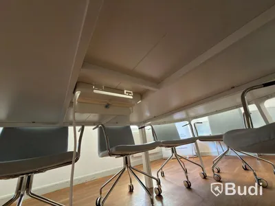 IKEA conference table with 11 designer armchairs: 5 Gärsnäs Day armchairs on castors and 6 Gärsnäs Day armchairs