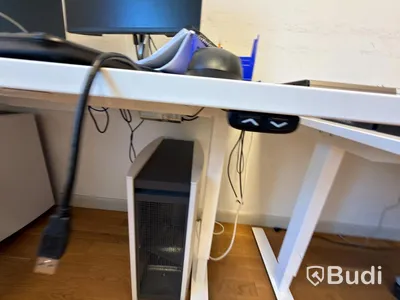 Office workstation with height-adjustable desk, Kinnarps chair, and 2 Dell monitors