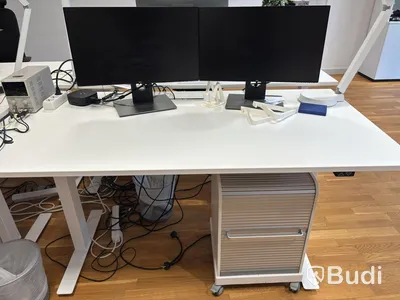 Office workstation with height-adjustable desk, Kinnarps chair, and 2 Dell monitors