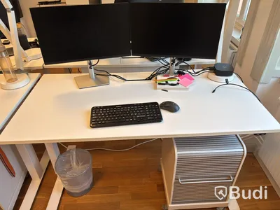 Office workstation with height-adjustable desk, Kinnarps chair, and 2 Dell monitors
