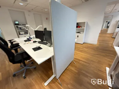 Office workstation with height-adjustable desk, Kinnarps chair, 2 Dell monitors, screen divider