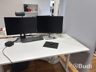 Office workstation with height-adjustable desk, Kinnarps chair, 2 Dell monitors, screen divider