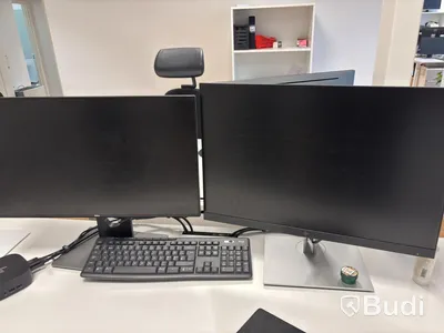 Office workstation with height-adjustable desk, Kinnarps chair, 2 Dell monitors, screen divider