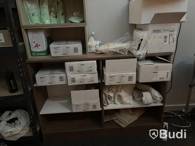 Lot of assorted cleaning supplies, incl. warehouse shelving and cabinets