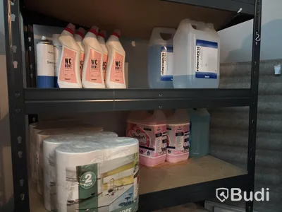 Lot of assorted cleaning supplies, incl. warehouse shelving and cabinets
