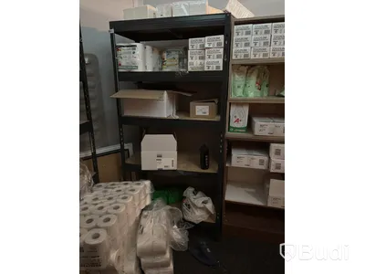 Lot of assorted cleaning supplies, incl. warehouse shelving and cabinets