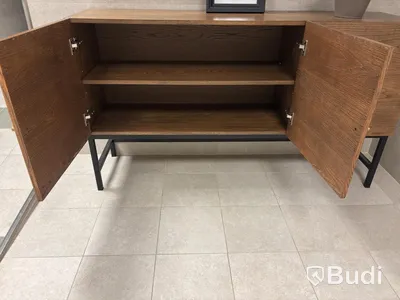 Cabinet including mirror and artificial plant