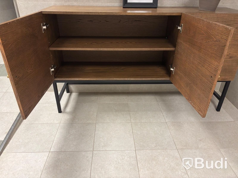 Cabinet including mirror and artificial plant