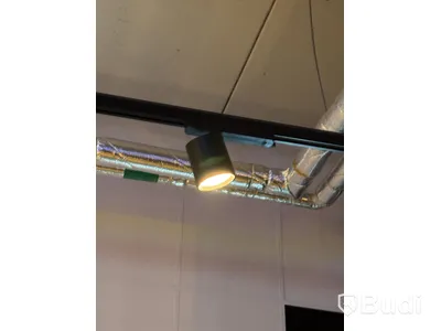 Track-mounted spotlights and lamps