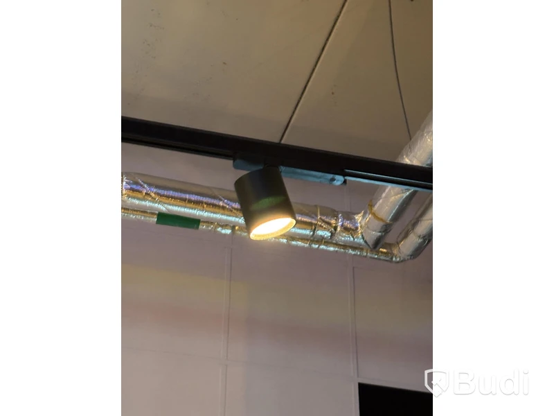 Track-mounted spotlights and lamps