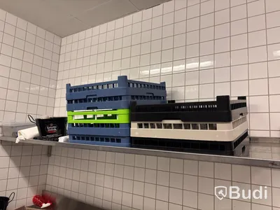 Dishwashing area with Metos WD dishwasher, incl. dishwashing tables, shelving and various accessories.