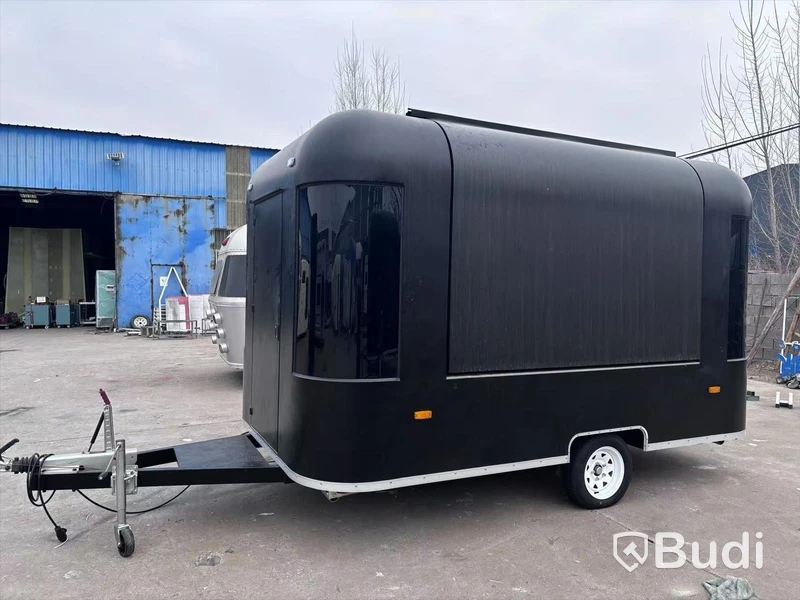 Unused food trailer with serving hatch, extractor fan and work surfaces