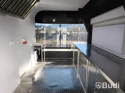 Unused food trailer with serving hatch, extractor fan and work surfaces