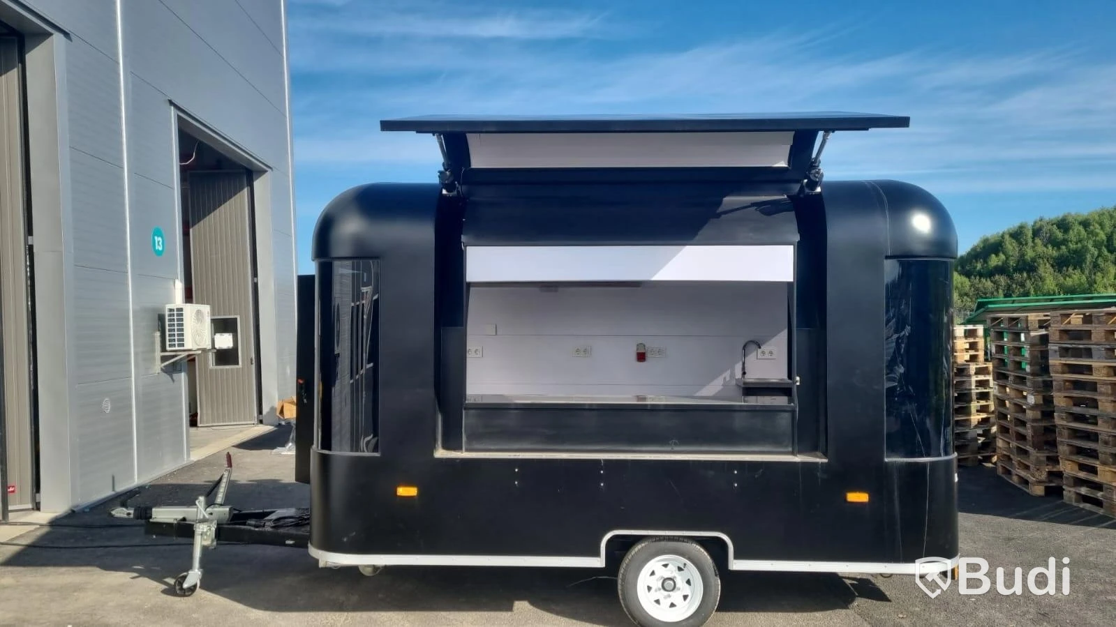 Unused food trailer with serving hatch, extractor fan and work surfaces