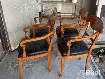 4 Selva armchairs, wood with black leather seats and nailhead trim