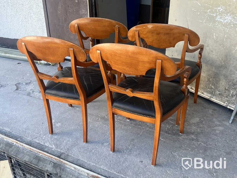 4 Selva armchairs, wood with black leather seats and nailhead trim