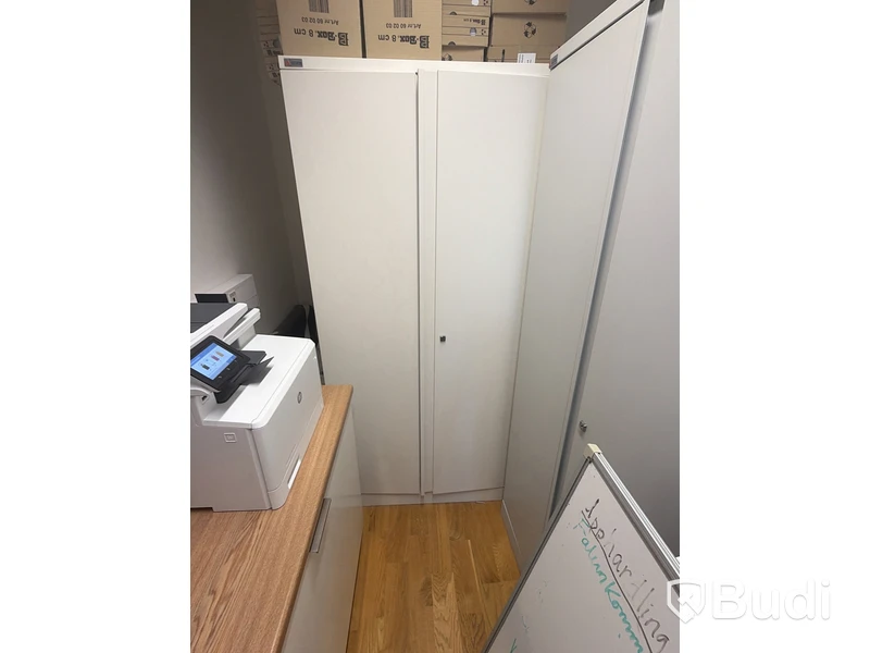 2 metal storage cabinets with double doors