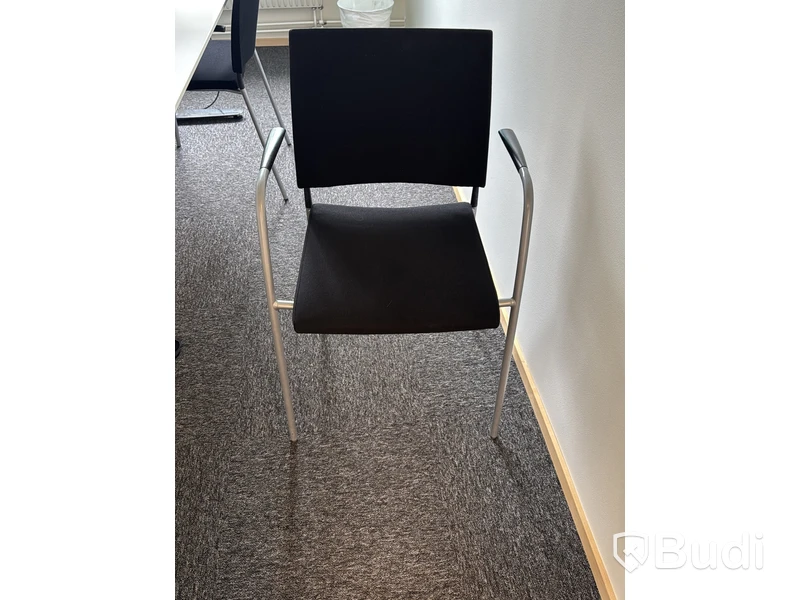 Conference table with 4 chairs and Philips 27-inch monitor