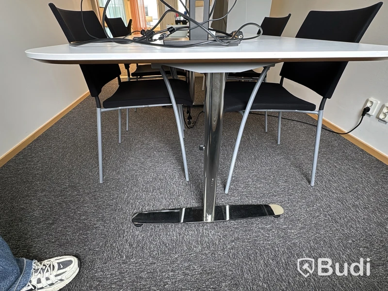 Conference table with 4 chairs and Philips 27-inch monitor