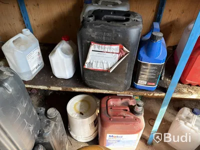 Metal shelving units with contents, ladders, etc.