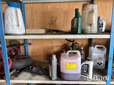 Metal shelving units with contents, ladders, etc.