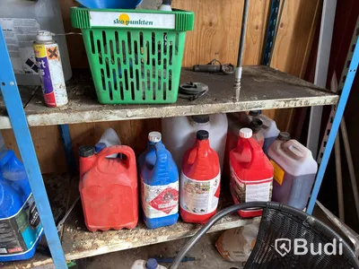 Metal shelving units with contents, ladders, etc.