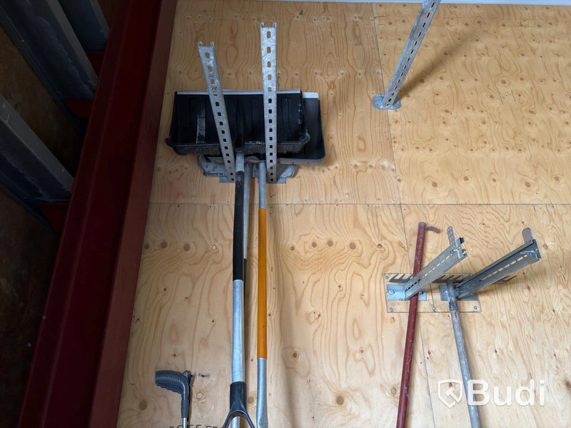 Metal shelving units with contents, ladders, etc.
