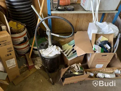 Metal shelving units with contents, ladders, etc.