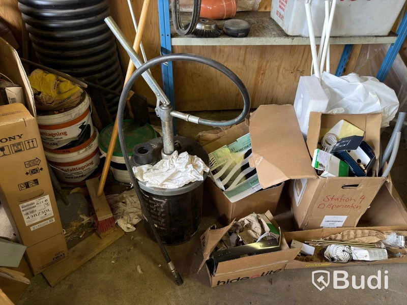 Metal shelving units with contents, ladders, etc.
