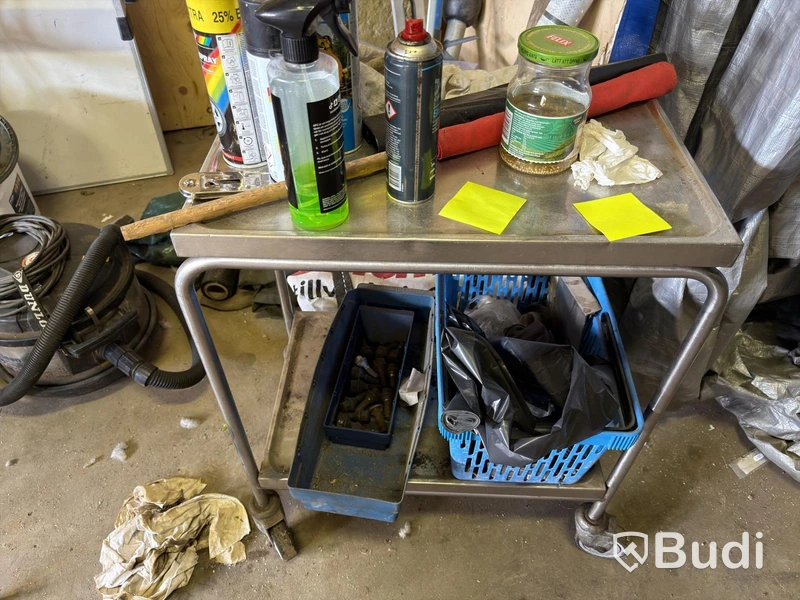 Metal shelving units with contents, ladders, etc.