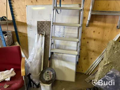 Metal shelving units with contents, ladders, etc.