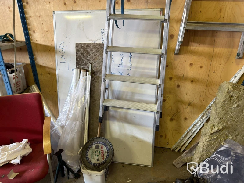 Metal shelving units with contents, ladders, etc.