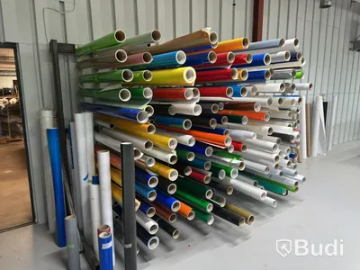 Rack with assorted rolls of material