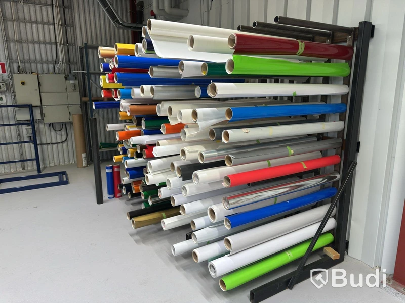 Rack with assorted rolls of material
