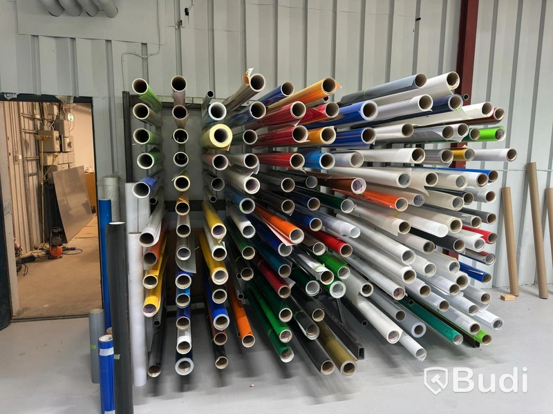 Rack with assorted rolls of material
