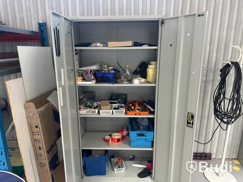 Grey metal storage cabinet with shelves and contents.