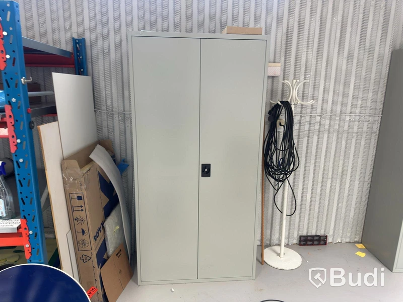 Grey metal storage cabinet with shelves and contents.