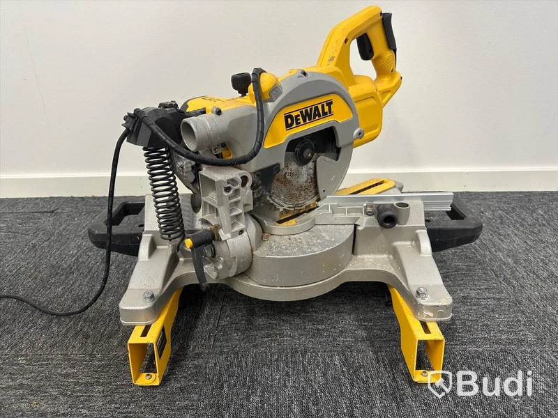 Kap-/gersåg Dewalt DWS777-QS med monteringsbyglar Dewalt DE7023-XJ