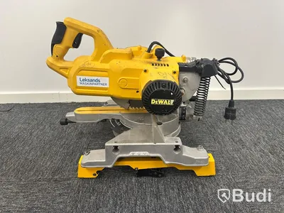 Kap-/gersåg Dewalt DWS777-QS med monteringsbyglar Dewalt DE7023-XJ