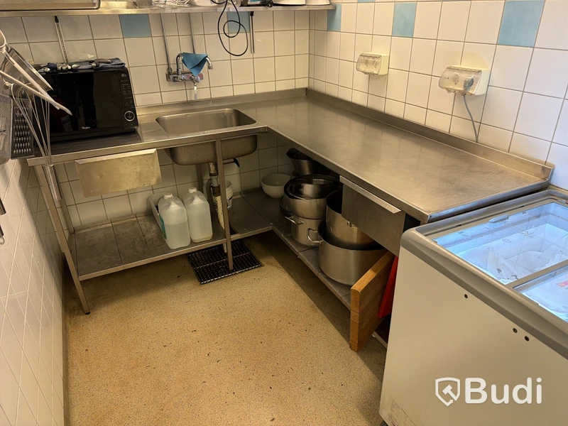 Rostfri arbetsbänk i hörnmodell med ho