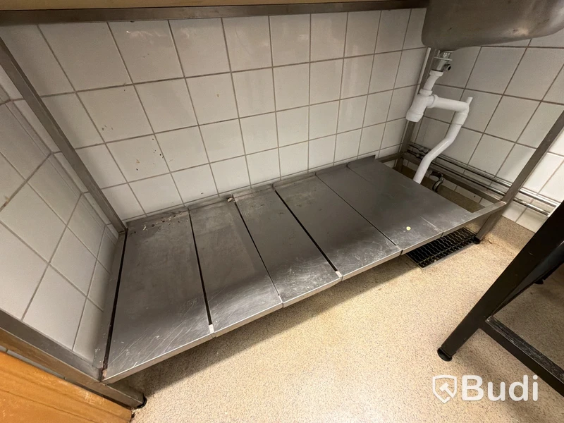 Rostfri arbetsbänk med ho