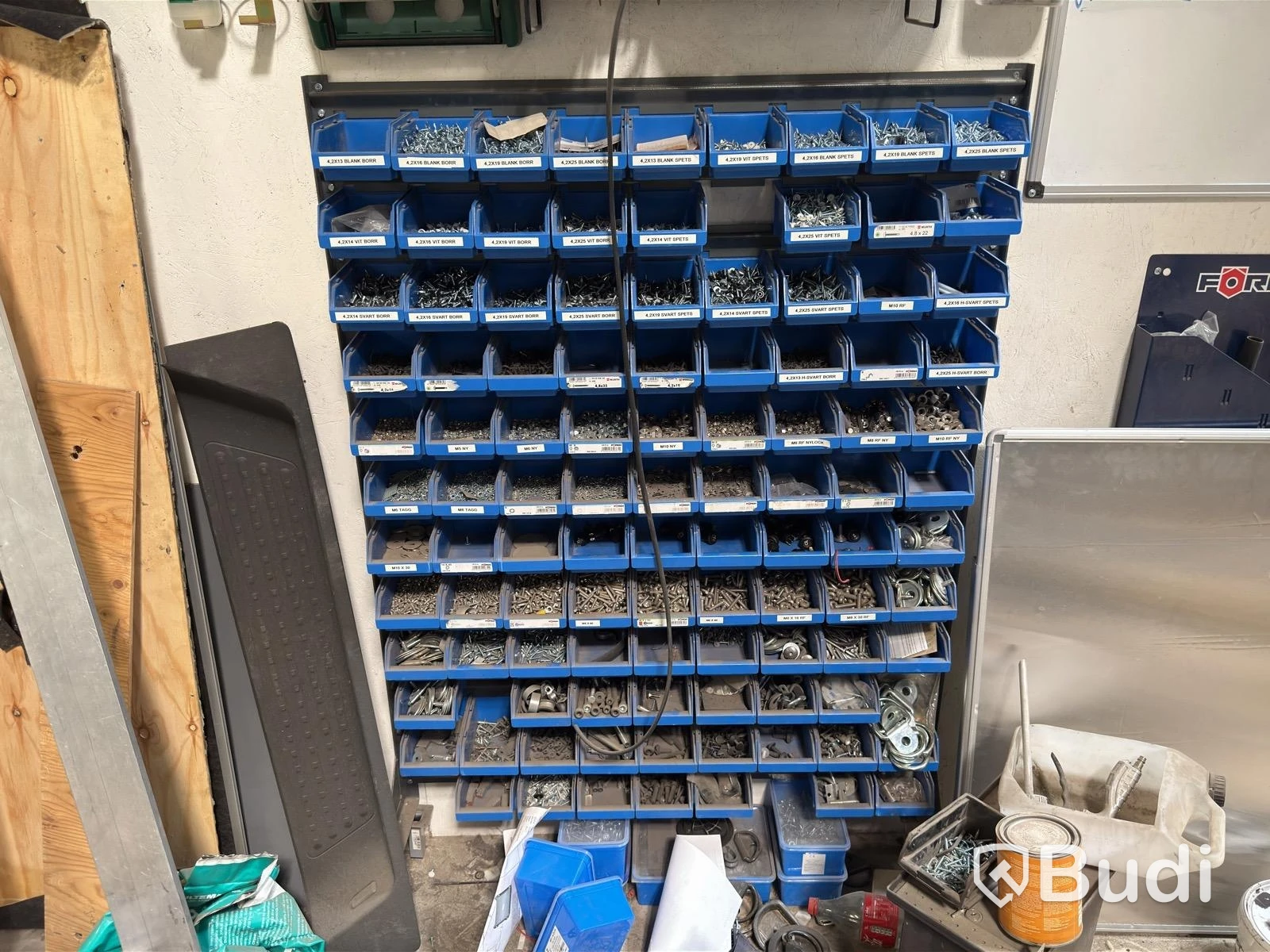 Wall-mounted organizer shelf with contents