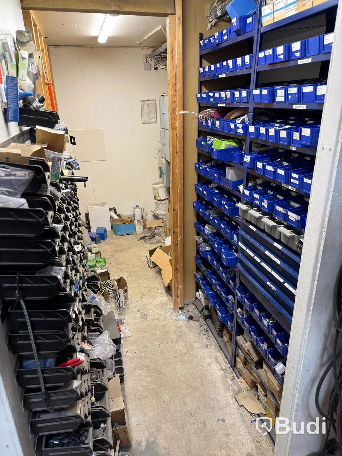 Storage shelving units with a large quantity of assorted bolts, nuts, etc.