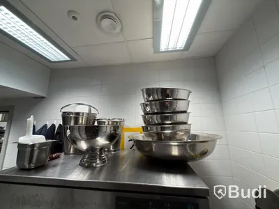 Lot of stainless steel ice buckets and a stainless steel bucket