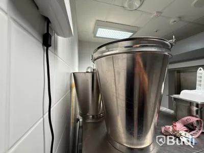 Lot of stainless steel ice buckets and a stainless steel bucket